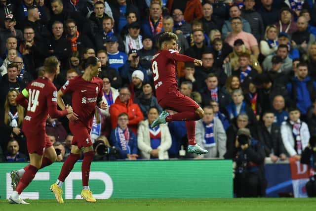 Roberto Firmino of Liverpool celebrates after scoring the first goal  