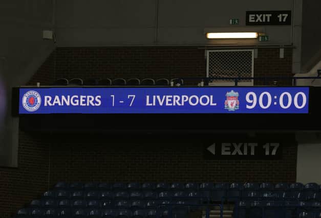 The scoreboard displaying the final score is seen during the UEFA Champions League group A match between Rangersand Liverpool at Ibrox Stadium