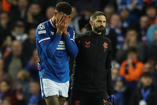 Connor Goldson of Rangers is seen as he leaves the pitch injured 