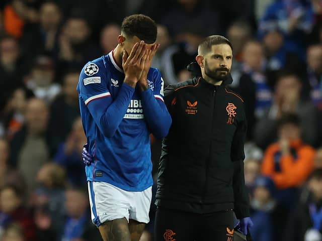 Connor Goldson of Rangers is seen as he leaves the pitch injured 