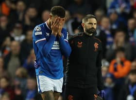 Connor Goldson of Rangers is seen as he leaves the pitch injured 