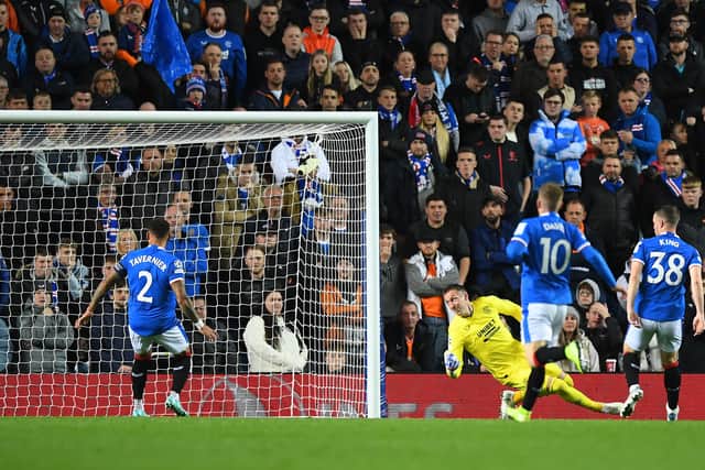 Rangers' Scottish goalkeeper Allan McGregor (3R) watches as Liverpool's Egyptian striker Mohamed Salah (not seen) scores his team's fourth goal 