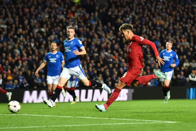 Roberto Firmino of Liverpool scores the second goal making the score 1-2  