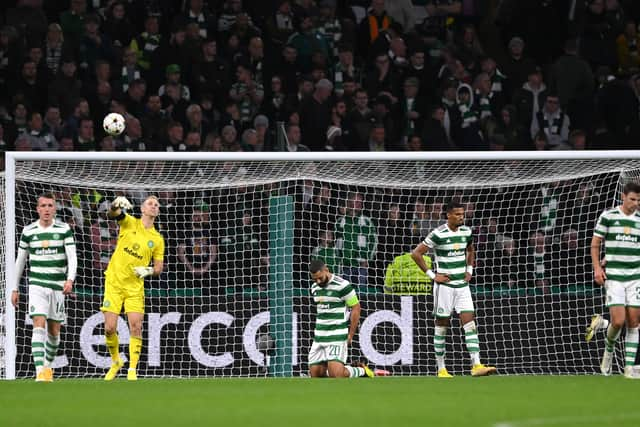 Celtic captain Cameron Carter-Vickers (c) reacts after the second Leipzig goal