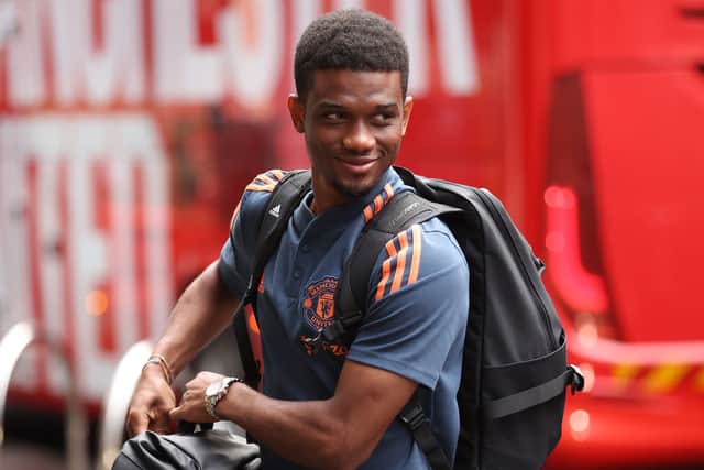 Manchester United's Amad Diallo makes his way towards the hotel upon team's arrival in Melbourne