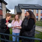 First Minister Nicola Sturgeon with Cromdale Square residents Terri Nimmo (left) and Jennafer Browning. Pic: Martin Shields.