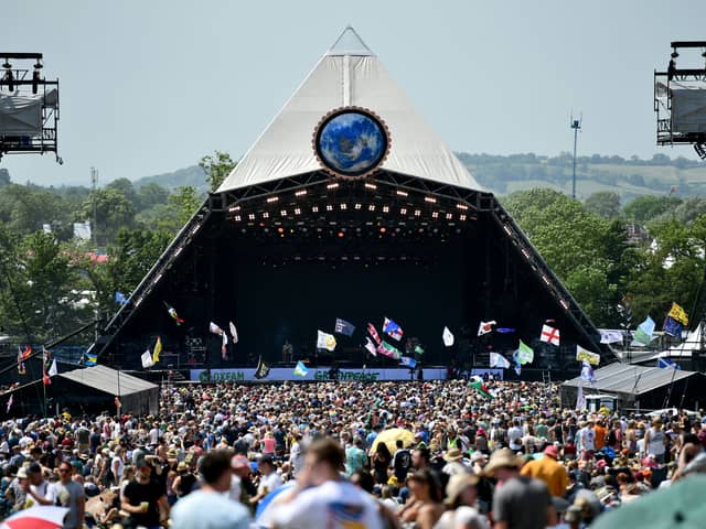 Crowds of festival-goers watch Tom Odell perform on the Pyramid Stage during day three of Glastonbury Festival 2019