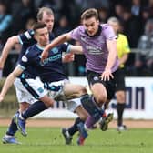 James Sands is challenged by Cammy Kerr during the Scottish Cup Sixth Round match between Dundee FC and Rangers FC at Dens Park Stadium in March 2022