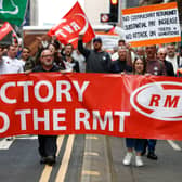 RMT supporters march from the offices of Network Rail following the industrial action last March 