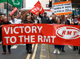 RMT supporters march from the offices of Network Rail following the industrial action last March 