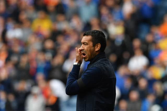 Giovanni van Bronckhorst, manager of Rangers look on