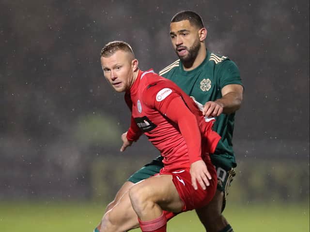 Curtis Main of St Mirren is challenged by Cameron Carter-Vickers of Celtic during the Cinch Scottish Premiership match
