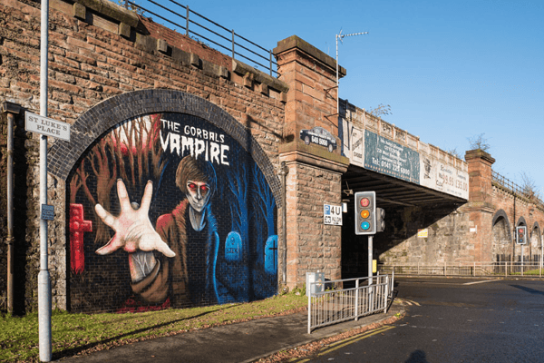 A mural of the Gorbals Vampire by local teenage artist Ella Bryson and Art Pistol street artists, Ejek, in an archway on St Luke’s Place near the Citizens’ Theatre