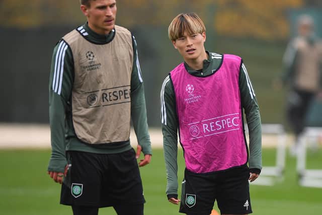 Celtic’s Swedish defender Carl Starfelt (L) takes part in a training session at Lennoxtown