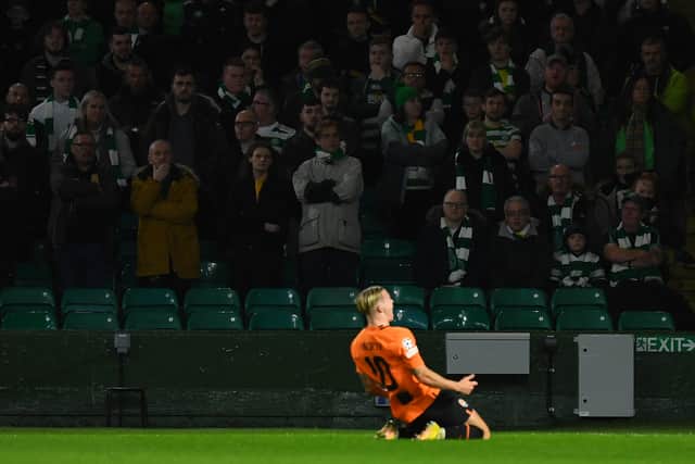 Mykhaylo Mudryk celebrates in front of the Celtic supporters after scoring