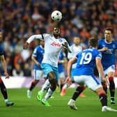 Napoli's Cameroonian midfielder Andre Zambo Anguissa (C) attemps to control the ball as Rangers' Scottish midfielder Ryan Jack (R), Rangers' US midfielder James Sands (2nd R) and Rangers' Croatian defender Borna Barisic (L) eye the ball