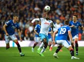 Napoli's Cameroonian midfielder Andre Zambo Anguissa (C) attemps to control the ball as Rangers' Scottish midfielder Ryan Jack (R), Rangers' US midfielder James Sands (2nd R) and Rangers' Croatian defender Borna Barisic (L) eye the ball
