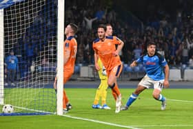 Napoli’s Argentinian forward Giovanni Simeone (R) reacts as he scores a goal  during the UEFA Champions League Group A second leg match against Rangers at the Diego Armando Maradona Stadium in Naples
