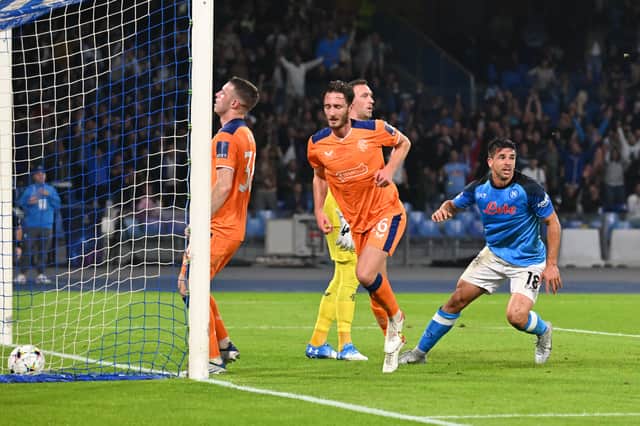 Napoli’s Argentinian forward Giovanni Simeone (R) reacts as he scores a goal during the UEFA Champions League Group A second leg match against Rangers at the Diego Armando Maradona Stadium in Naples