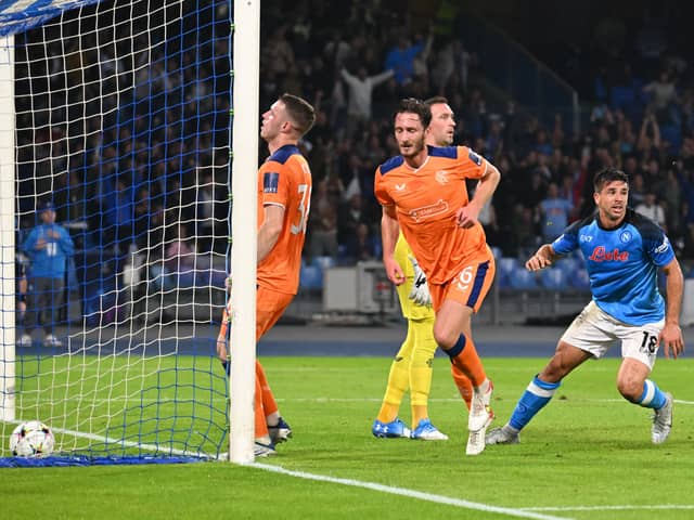 Napoli’s Argentinian forward Giovanni Simeone (R) reacts as he scores a goal  during the UEFA Champions League Group A second leg match against Rangers at the Diego Armando Maradona Stadium in Naples