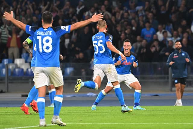 Napoli's Norwegian defender Leo Ostigard (C) celebrates with Napoli's Italian forward Giacomo Raspadori (R) after scoring his team's third goal 