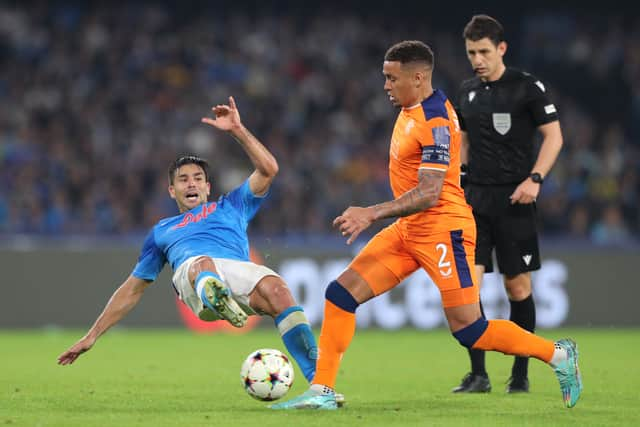 Giovanni Simeone of Napoli challenges James Tavernier of Rangers 