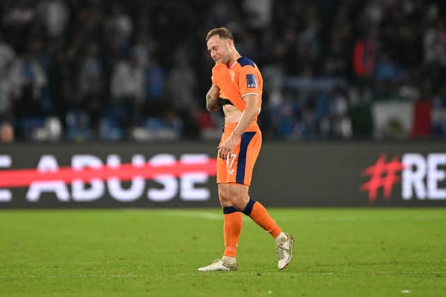 Scott Arfield of Rangers looks dejected after the final whistle of the UEFA Champions League group A match between SSC Napoli and Rangers FC at Stadio Diego Armando Maradona