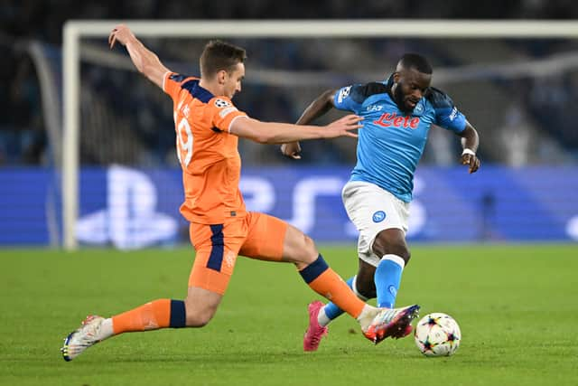 James Sands of Rangers challenges Tanguy NDombele of Napoli