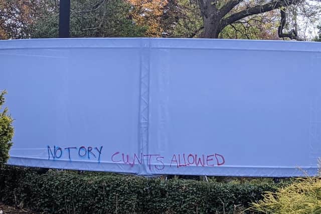 The anti-tory sentiment was scrawled into the temporary fence around Glasgow Botanic Gardens.