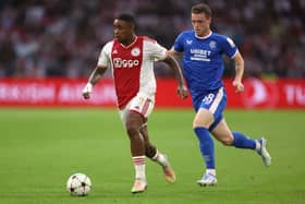 Steven Bergwijn of Ajax runs with the ball while under pressure from Leon King of Rangers during the UEFA Champions League group A match at Johan Cruyff Arena on September 07, 2022 in Amsterdam, Netherlands.