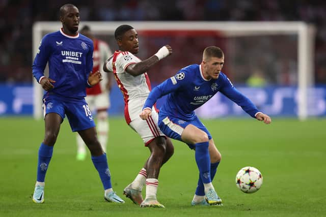 John Lundstram of Rangers battles for possession with Steven Bergwijn of Ajax