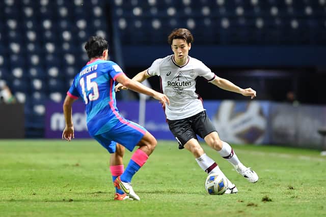 Yuki Kobayashi of Vissel Kobe takes on Roberto of Kitchee during the AFC Champions League Group J match between Kitchee and Vissel Kobe