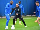 Rangers' Finnish midfielder Glen Kamara (L) and Rangers' Dutch manager Giovanni van Bronckhorst (C) take part in a team training session 
