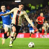 Rangers’ English winger Ryan Kent (L) vies with Ajax’s Mexican defender Edson Alvarez (R) 