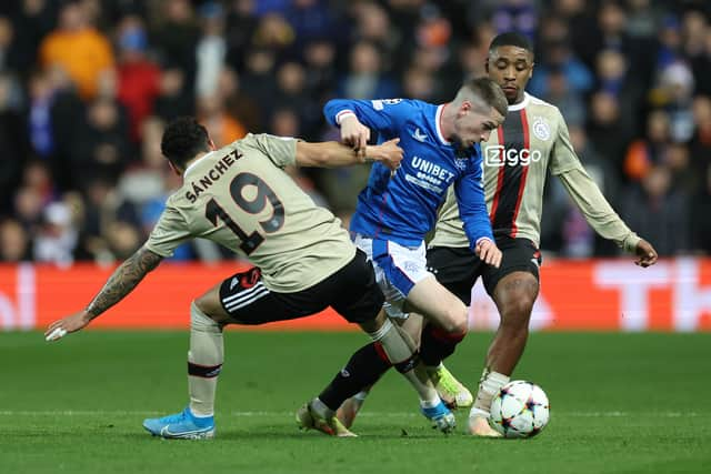 Jorge Sanchez of AFC Ajax challenges Ryan Kent of Rangers whilst under pressure from Steven Bergwijn 