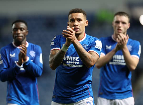 Rangers captain James Tavernier applauds the fans alongside Leon King and Fashion Sakalaa