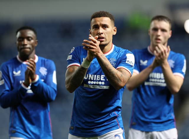 Rangers captain James Tavernier applauds the fans alongside Leon King and Fashion Sakalaa