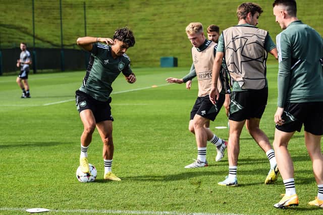 Celtic's Portuguese forward Jota (L) takes part in a training session