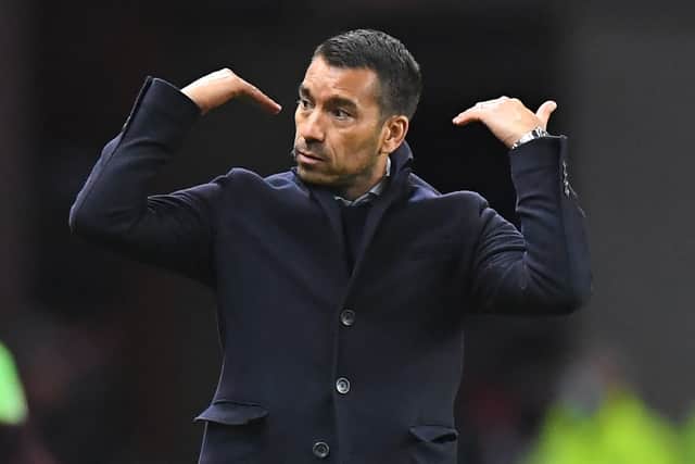 Rangers' Dutch manager Giovanni van Bronckhorst gestures on the touchline