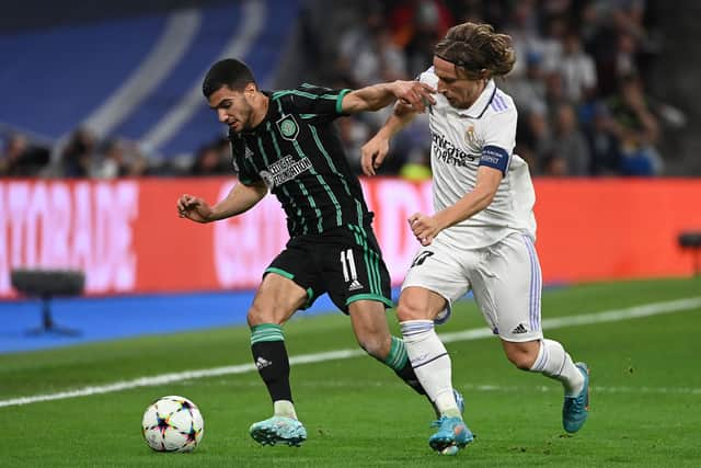 Celtic's Israeli striker Liel Abada (L) fights for the ball with Real Madrid's Croatian midfielder Luka Modric