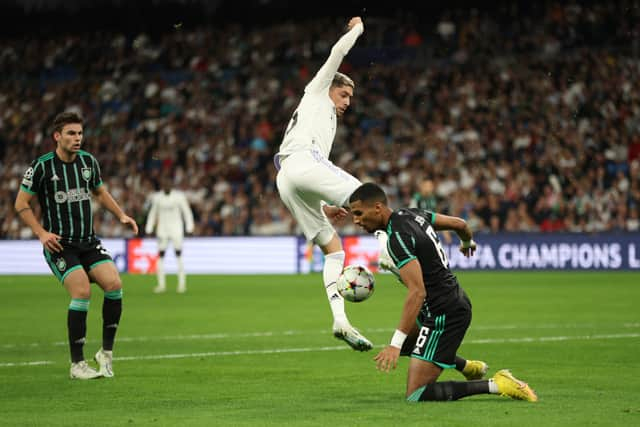 Federico Valverde of Real Madrid is challenged by Moritz Jenz of Celtic 