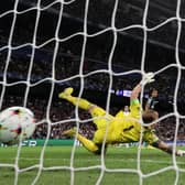 Marco Asensio of Real Madrid scores their sides third goal past Joe Hart of Celtic