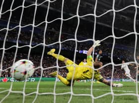 Marco Asensio of Real Madrid scores their sides third goal past Joe Hart of Celtic