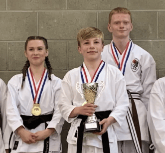 Zane Longmuir (middle) is a young carer and practitioner of Karate - the 15 year old is a rising star in the scene across Europe but he needs community support if he’s going to continue his rocketing martial arts career.