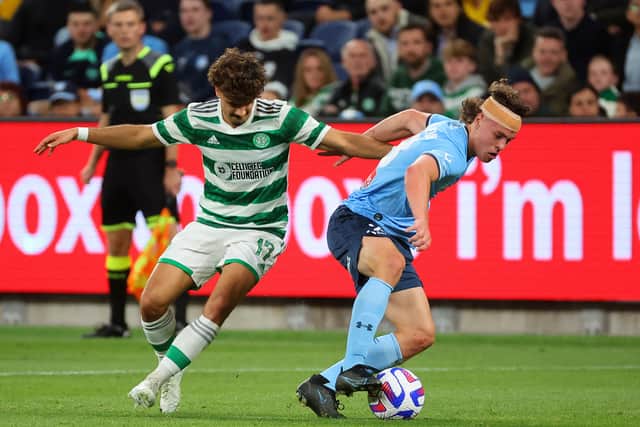 Sydney FC's Jake Girdwood-Reich (R) and Celtic FC's Jota fight for the ball 
