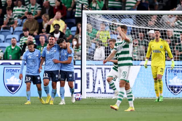 Robert Mak of Sydney celebrates scoring a goal with team mates