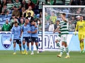 Robert Mak of Sydney celebrates scoring a goal with team mates