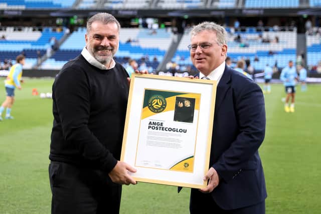 Celtic FC and former Socceroos manager, Ange Postecoglou accepts his induction into Football Australia's Hall of Fame from Football Australia Chairman, Chris Nikou prior to the Sydney Super Cup match