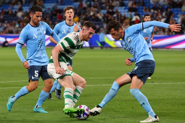 Celtic’s Anthony Ralston and Sydney FC’s Adrian Vlastelica (R) fight for the ball 