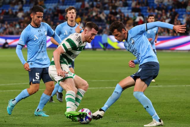 Celtic’s Anthony Ralston and Sydney FC’s Adrian Vlastelica (R) fight for the ball